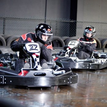 A group of friends racing Go-Karts